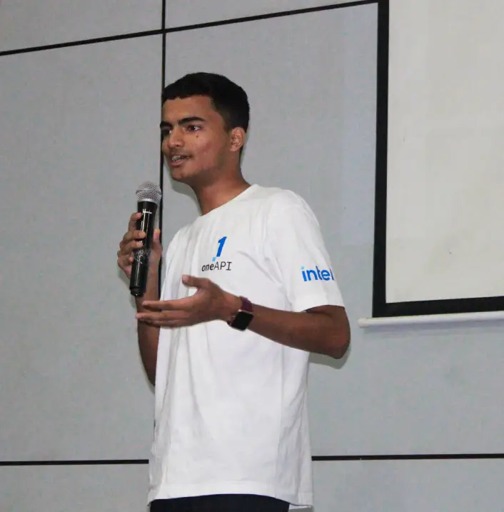 Speaking on stage at for a hackathon presentation